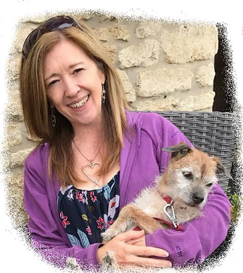 woman holding a small dog